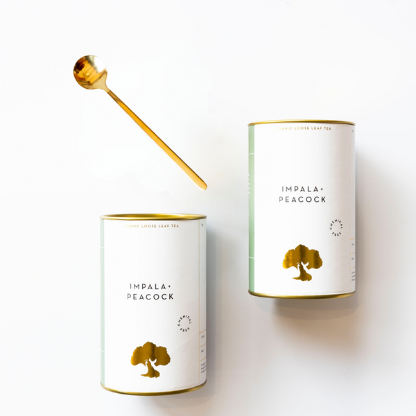 two canisters with gold teaspoon impala peacock